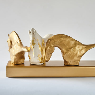 "Contagious" Ceramic sculpture by Emma Tate | Horse polo art gallery | White ceramic and gold